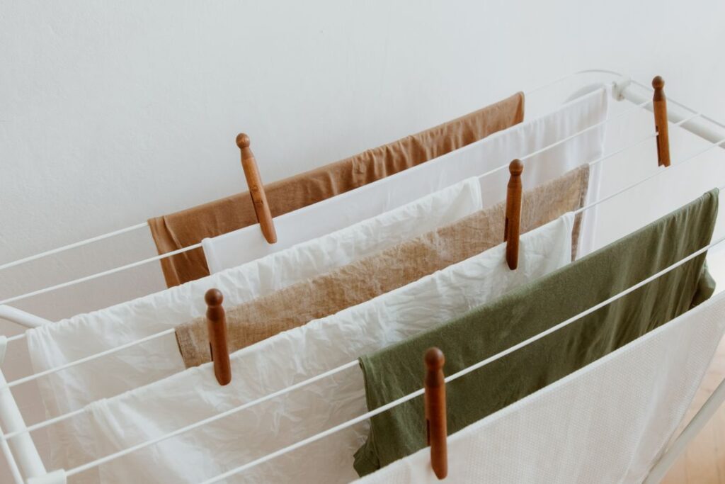 Clothes drying indoors on a folding rack without musty smell