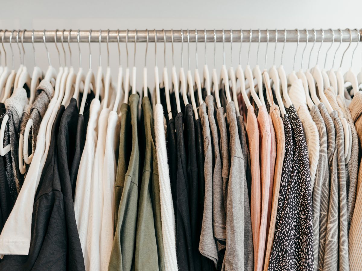 Clothes on slim hangers helping organize a tiny closet