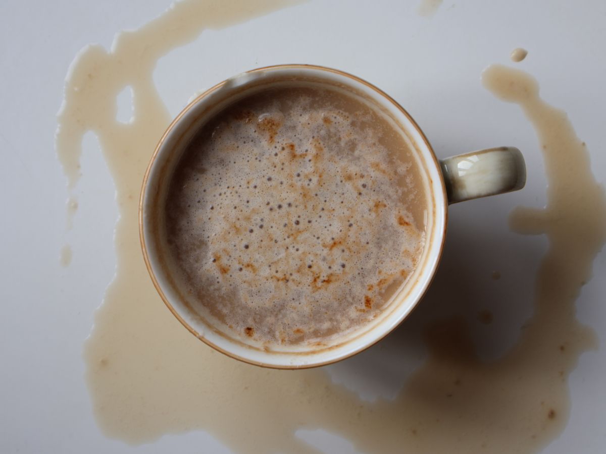 A spilled coffee cup illustrating a fresh coffee stain
