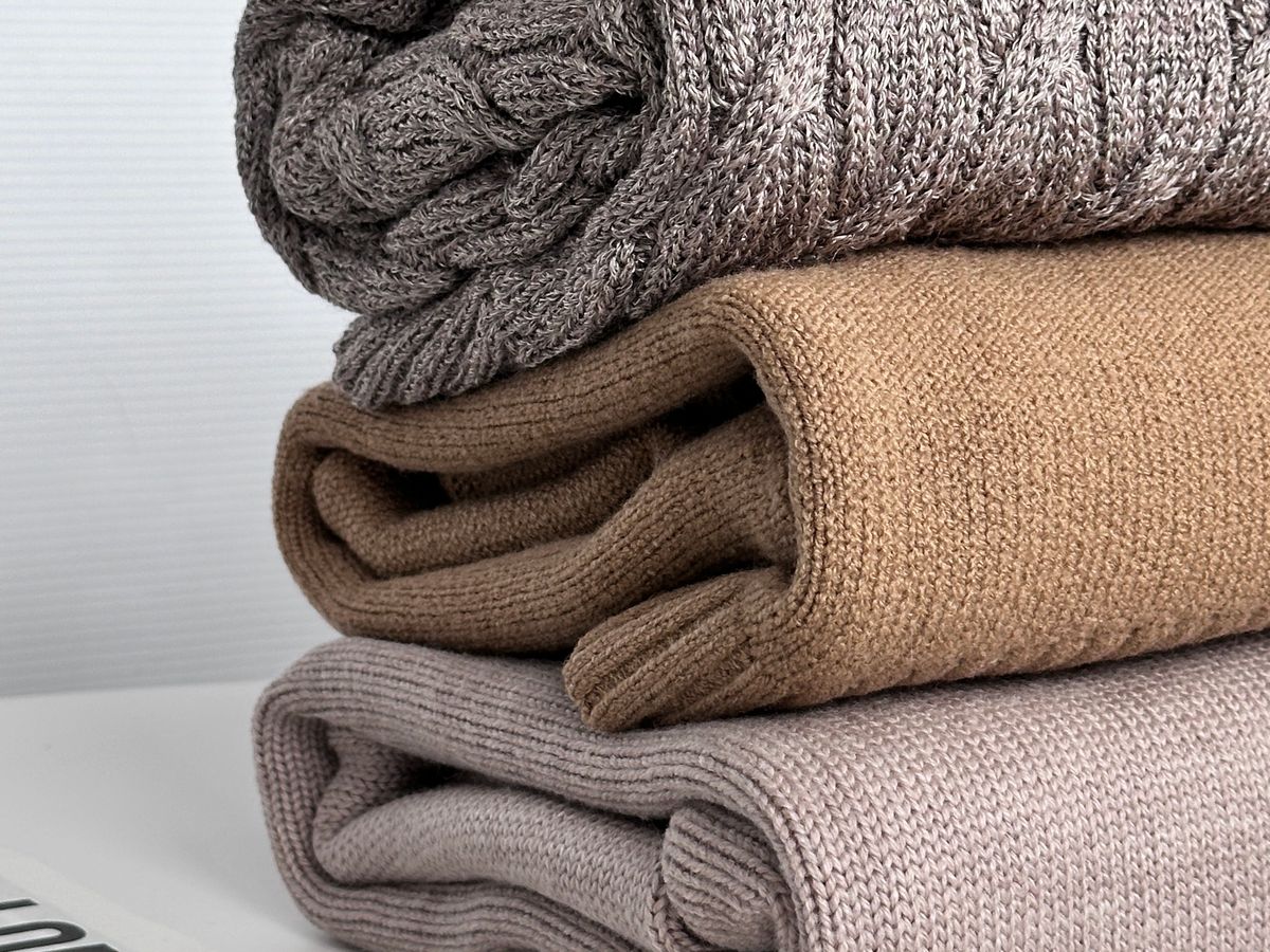 Stacked clean blankets and comforters folded neatly