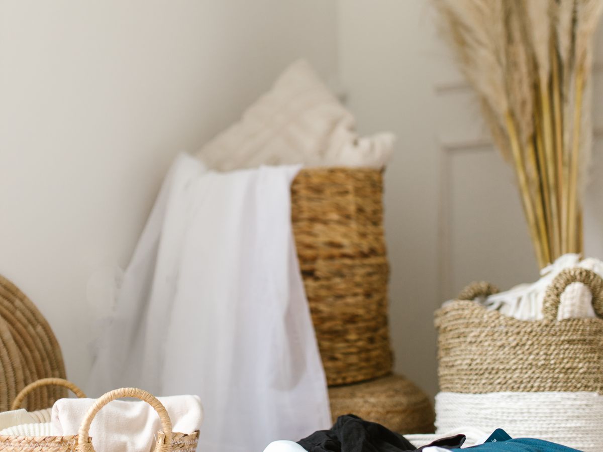 Cozy laundry room with woven baskets and shelving