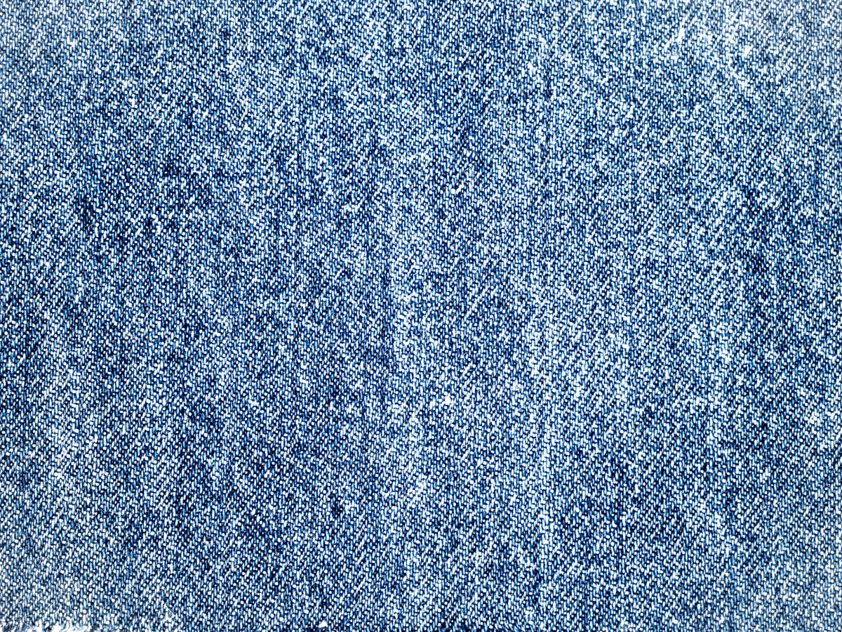 Close up of woven denim fabric that fades as you care for denim
