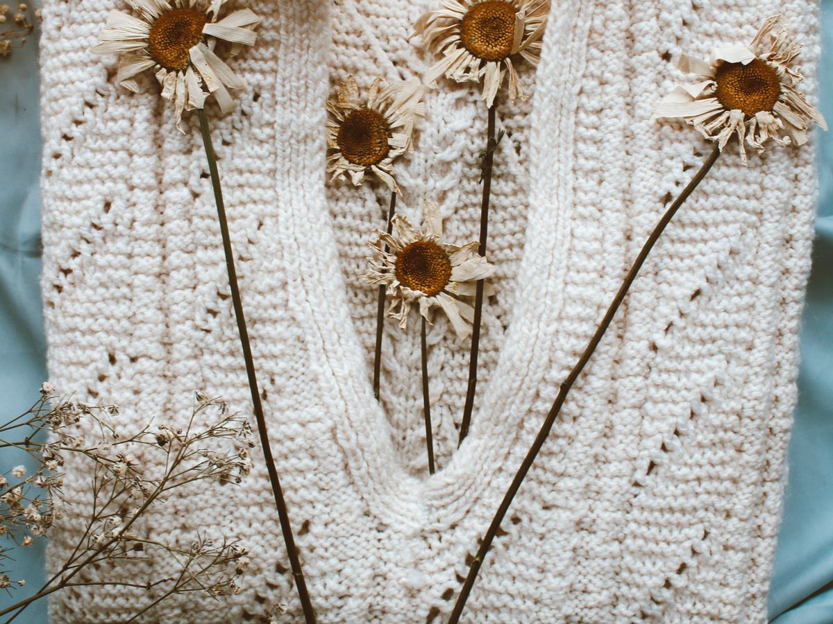Knit sweater laid flat to dry to protect its shape