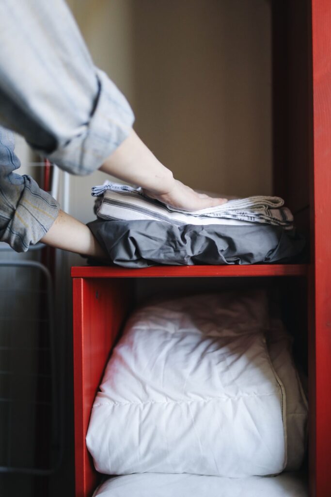 How to fold clothes to save space in a cabinet drawer