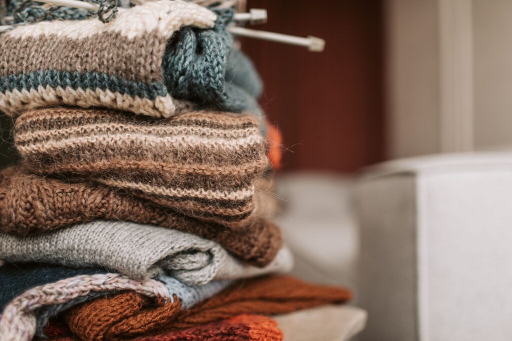 Close-up of folded knitted wool sweaters