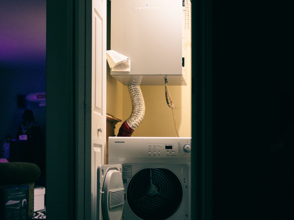 Home laundry closet with a machine dryer for fast drying