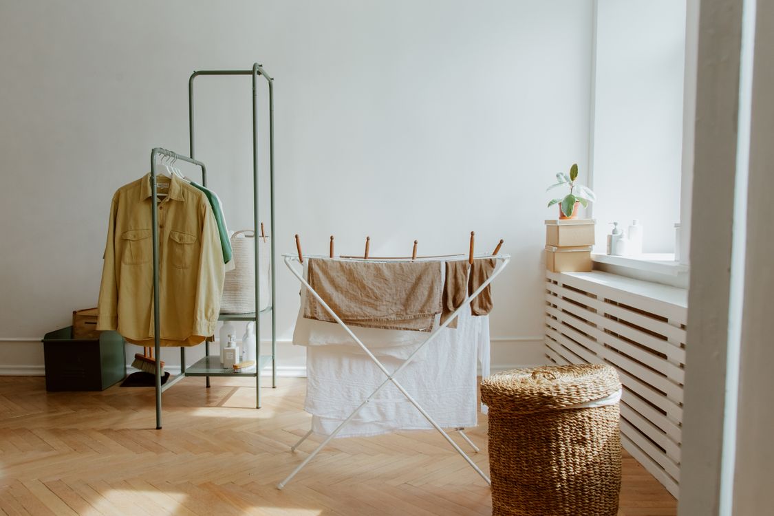 Well-ventilated indoor laundry room drying setup with natural light