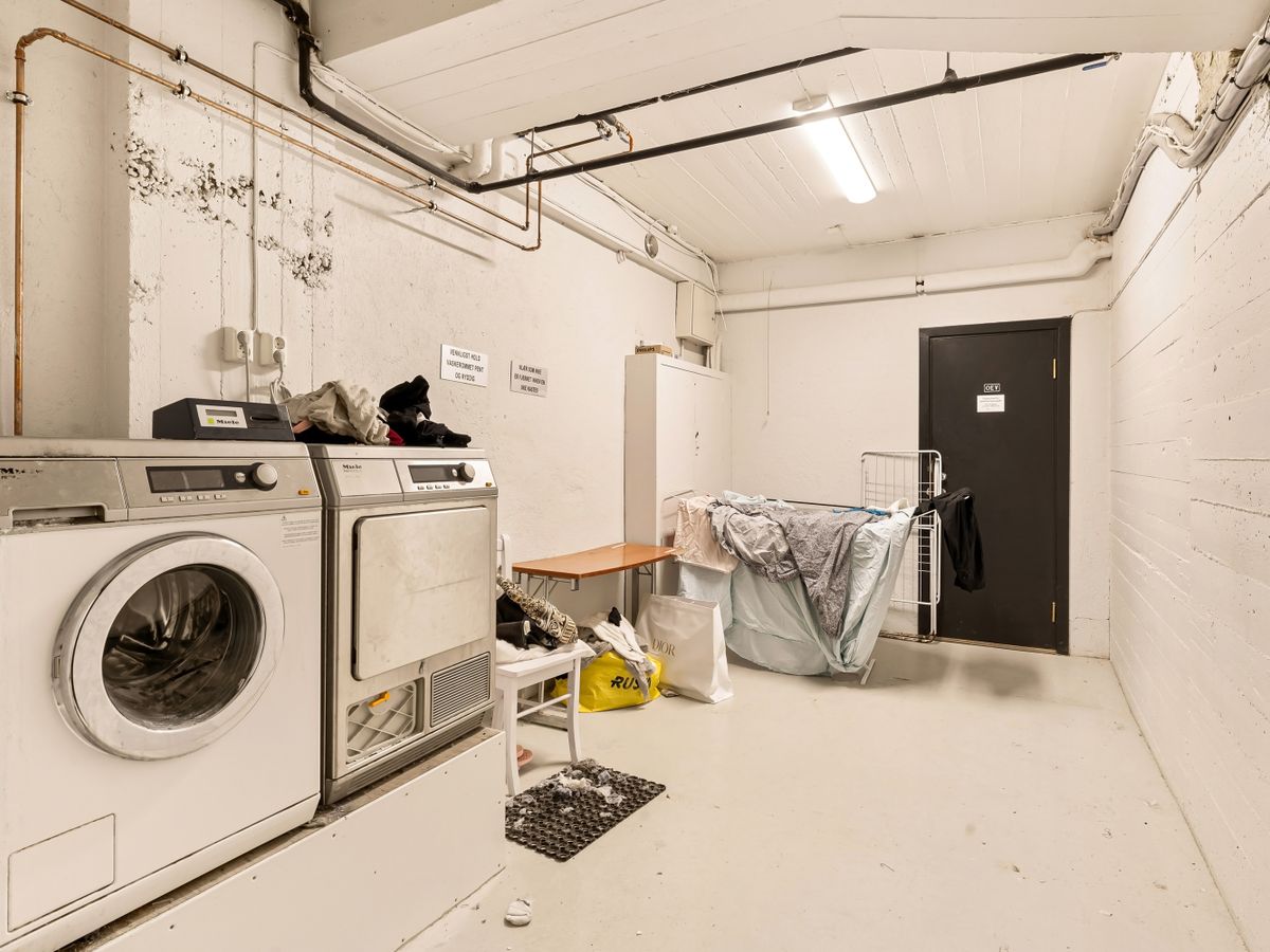 Home laundry room with a washing machine and dryer for weekly loads