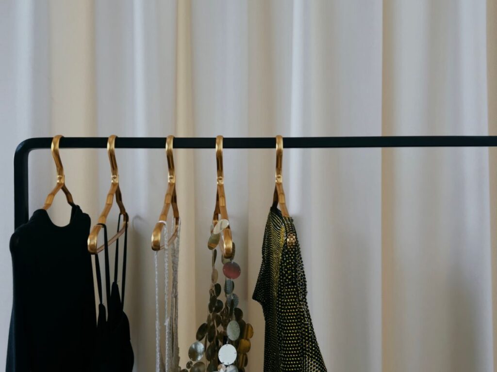 Elegant minimalist clothing rack showing well-cared-for clothes that look expensive