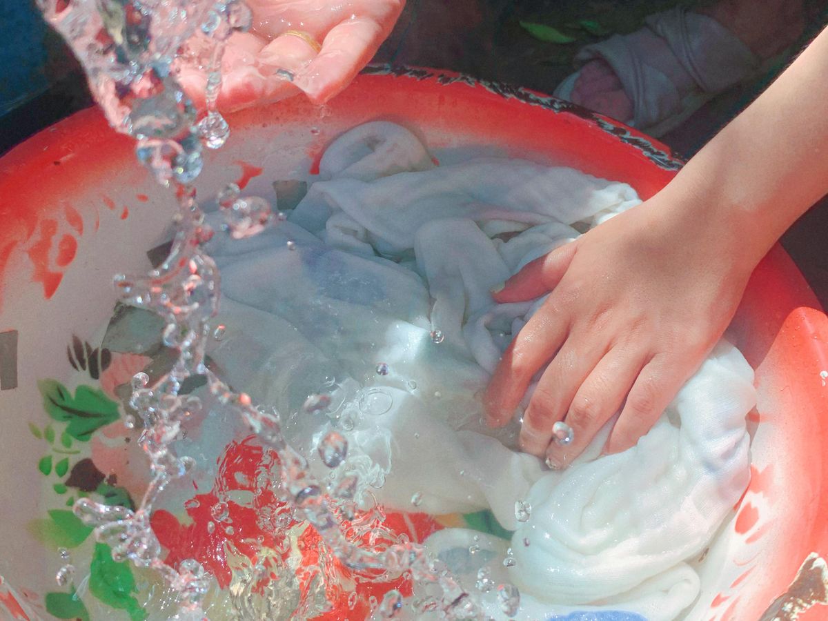 Soaking to fix shrunken clothes by relaxing the fibers in a basin