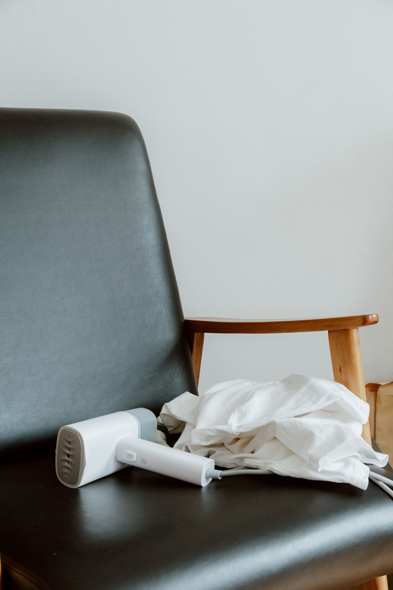 Choosing between a steamer and iron for everyday garment care