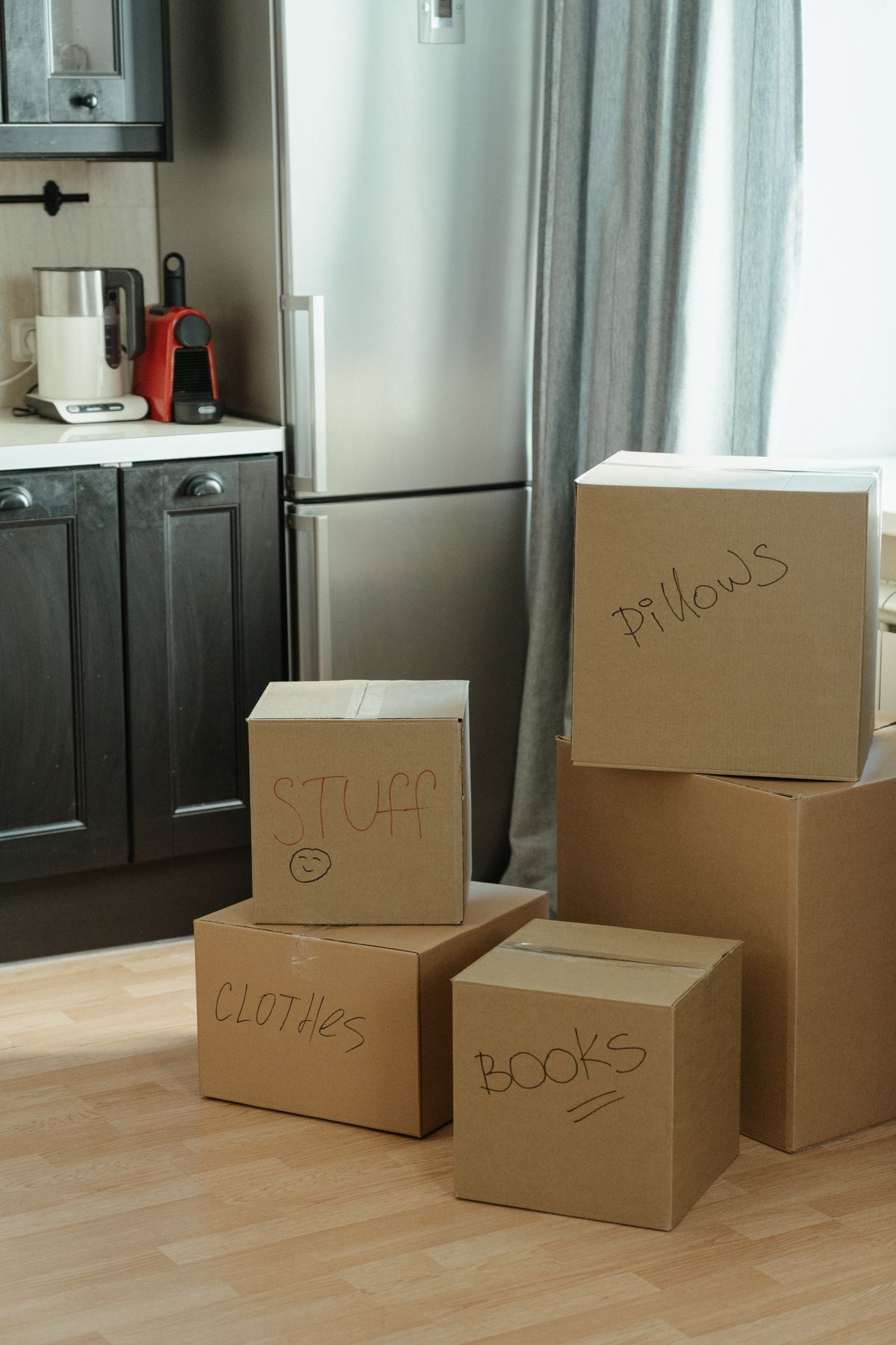 Storage boxes stacked on a cabinet to store off-season clothes