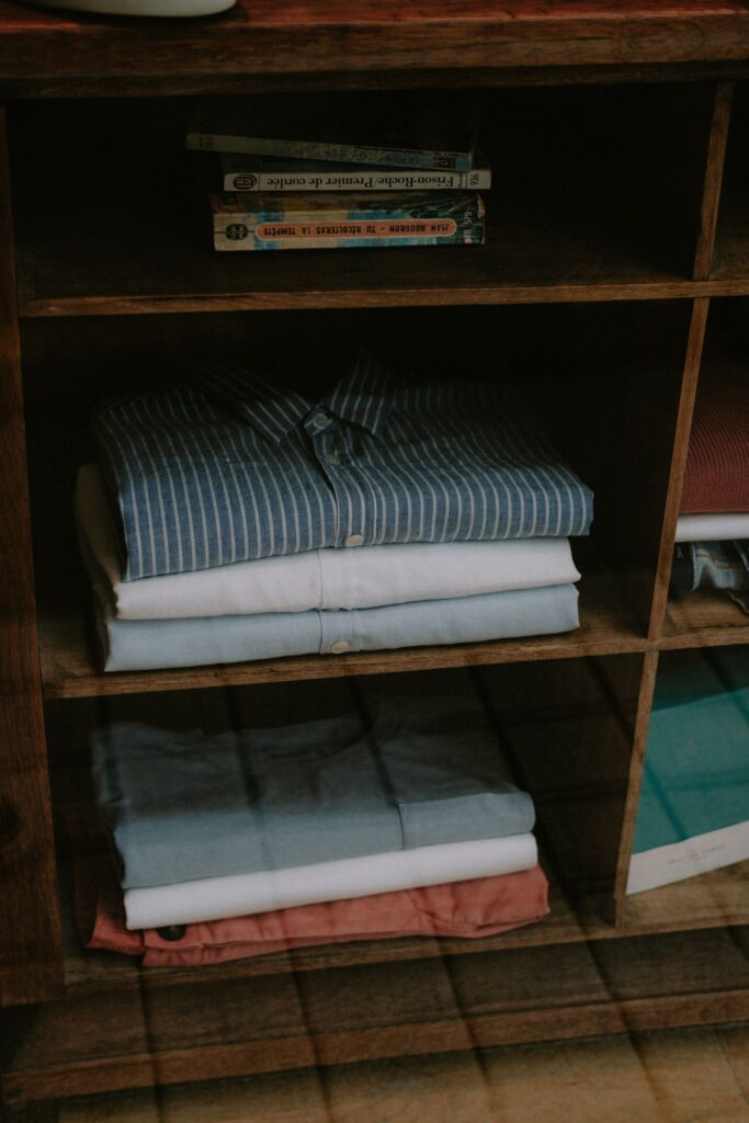 Stored clothes smelling fresh on a tidy wooden shelf