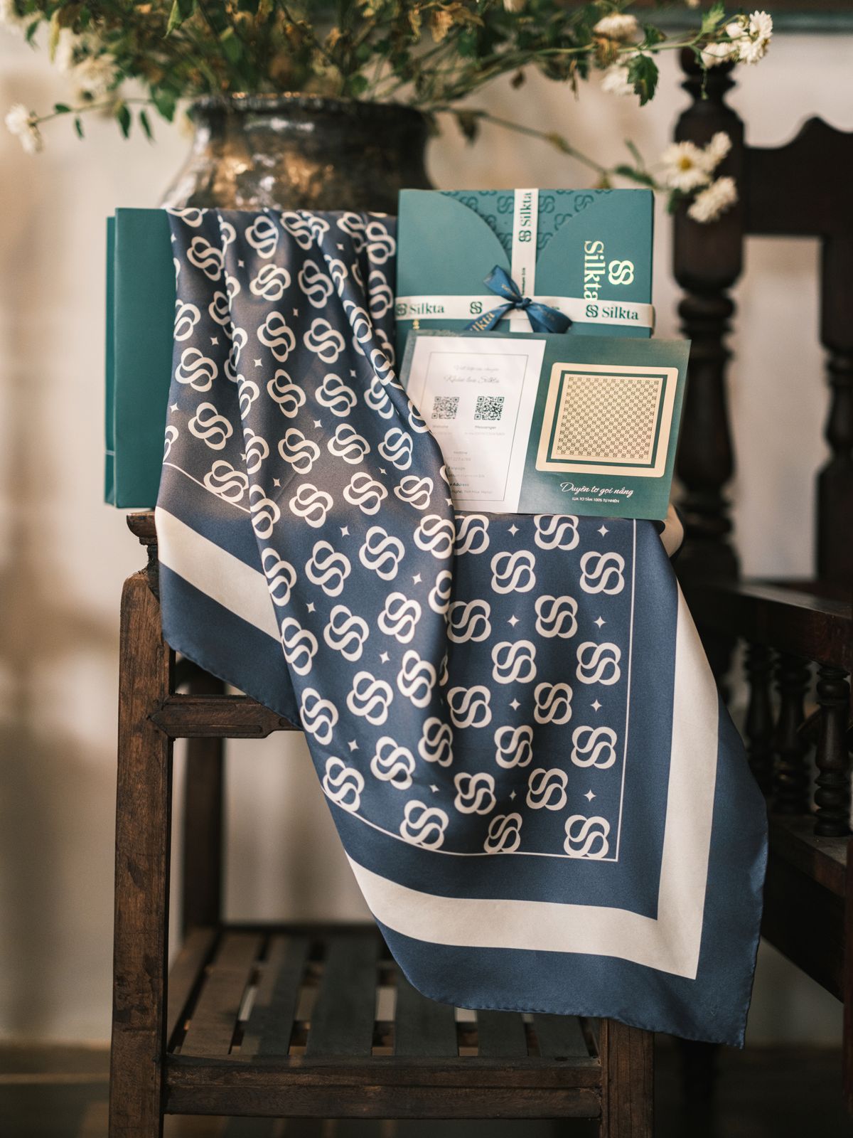 A silk scarf stored loosely draped to avoid hard crease lines