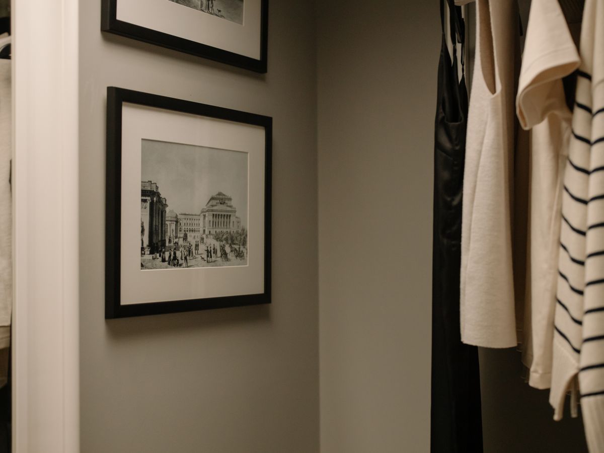 Vertical hanging storage used to organize a tiny closet