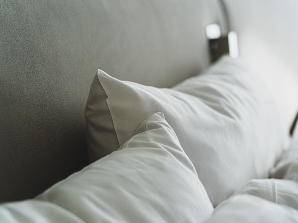 White pillows and bedding that need washing at home
