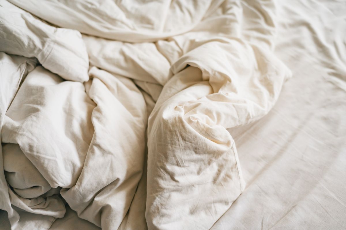 Fresh white linen bedding that should be washed about once a week